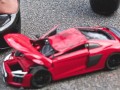 Crush of Red Audi R8 model toy car with Black Pump Stilettos