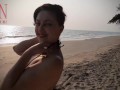 Nice lady at lonely nudist beach. Red swimsuit. Red bikini.
