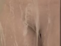 Milf seductively showers and plays with large, pierced breasts and horny, pierced pussy
