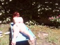 Nicoletta sunbathes in a public garden wearing a big dirty diaper