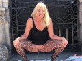 Hot blonde MILF in heels and fishnets takes a public piss at a cemetery