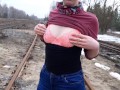 Girl undresses on the train tracks
