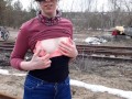 Girl undresses on the train tracks