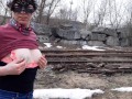 Girl undresses on the train tracks