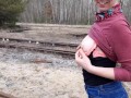 Girl undresses on the train tracks
