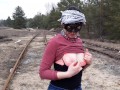 Girl undresses on the train tracks