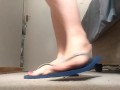 dangling and showing off sexy feet in flipflops