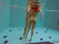 Two hot chicks enjoy swimming pool naked