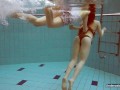 Two hot chicks enjoy swimming pool naked