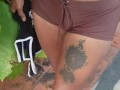 Slave May is showing her tattoos next to the swimming pool
