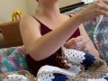 Creature crocheting and singing a tune