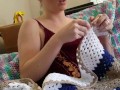 Creature crocheting and singing a tune