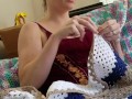 Creature crocheting and singing a tune