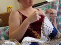 Creature crocheting and singing a tune