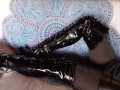 Laura on Heels amateur 2021 on a sofa wearing black sexy platform boots over the knees