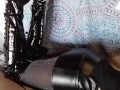 Laura on Heels amateur 2021 on a sofa wearing black sexy platform boots over the knees