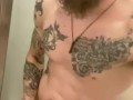 Tattooed male taking shower while jerking off, talking, and cumming 