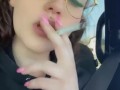 Smoking a cigarette in the car