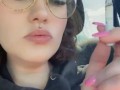 Smoking a cigarette in the car