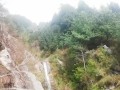 I walk by a Difficult path in the mountain's Forest for do something near the waterfall