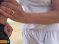 She loves to make a handjob on the crowded beach