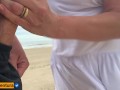 She loves to make a handjob on the crowded beach
