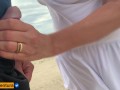 She loves to make a handjob on the crowded beach
