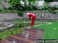Hot Blonde Girl Works And Piss Outdoor In The Garden In Red Latex Catsuit + Gloves + High Heels