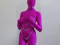 My Iron Maiden Corset is locked over a pink zentai