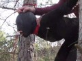 Tied up to a tree outdoor on sexy clothes, wearing pantyhose and high ankle boots heels, rough fuck