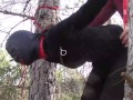 Tied up to a tree outdoor on sexy clothes, wearing pantyhose and high ankle boots heels, rough fuck