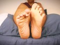 Lustful ebony teasing you with her sexy soles