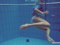 Sexy tight teen Marusia swims naked underwater