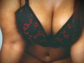 Naughty ebony with galsses on seducing you with her lustful tits
