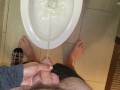 She aims his dick at the hotel toilet