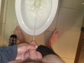 She aims his dick at the hotel toilet