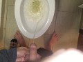 She aims his dick at the hotel toilet