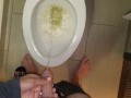 She aims his dick at the hotel toilet