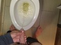 She aims his dick at the hotel toilet