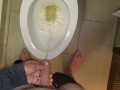 She aims his dick at the hotel toilet