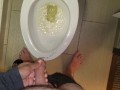 She aims his dick at the hotel toilet