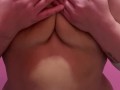 Lonely BBW massages oily breasts.