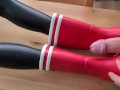 Cumming on her red rubberboots