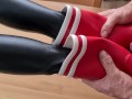 Cumming on her red rubberboots
