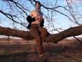 Girl undresses in nature