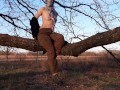 Girl undresses in nature