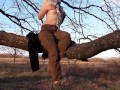 Girl undresses in nature
