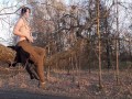 Girl undresses in nature