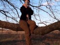 Girl undresses in nature