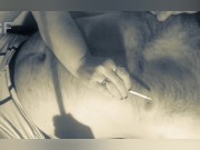 He smokes a cigarette and licks his lover's nipples